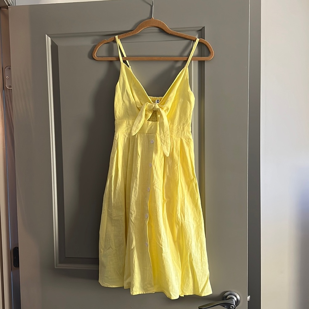 Cute yellow summer dress with open front and bow